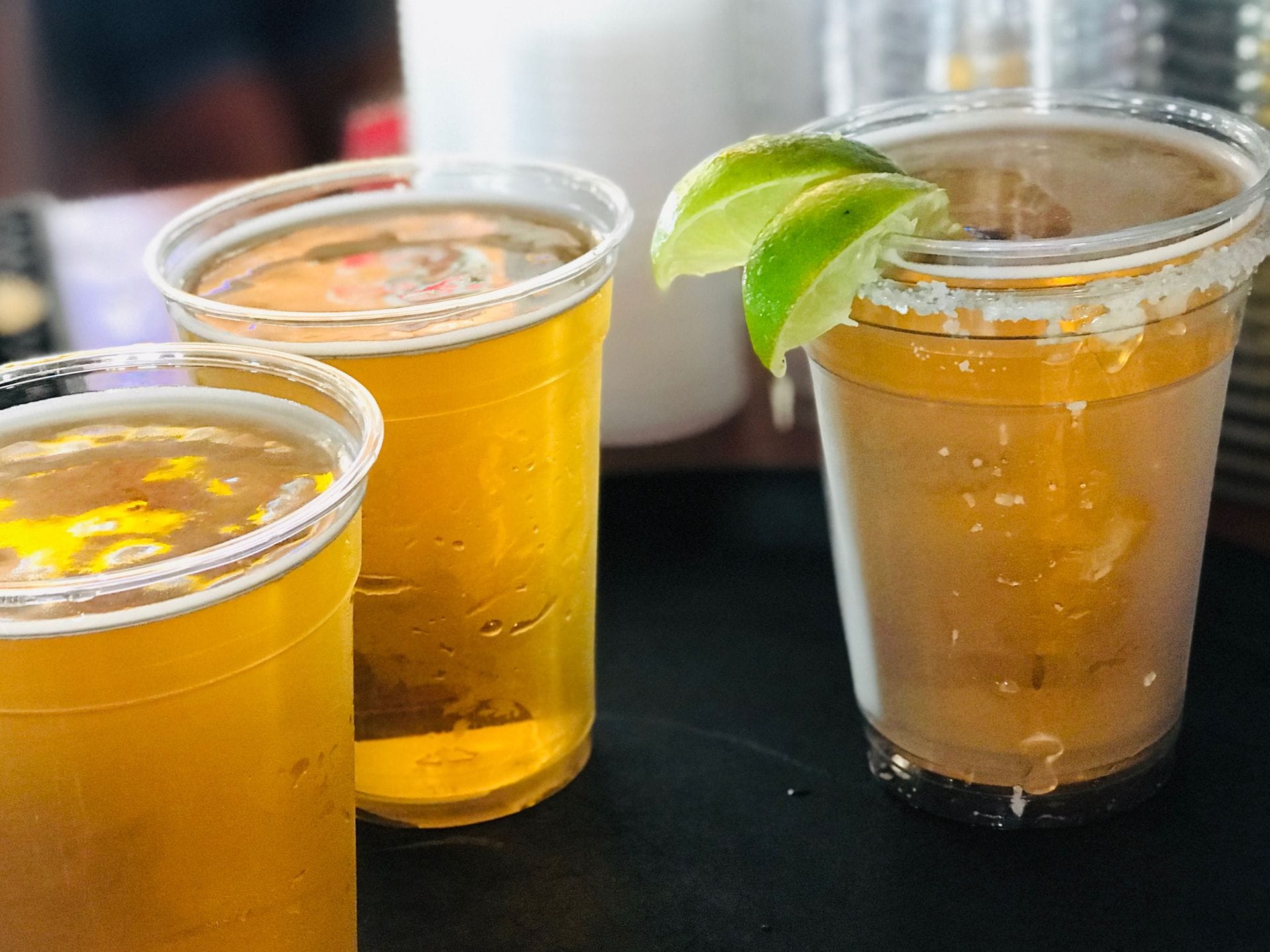 Cold draft beers and a salt-rimmed margarita served at the bar at Papa's
