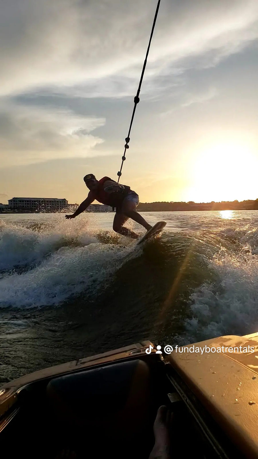Wake surfing at sunset